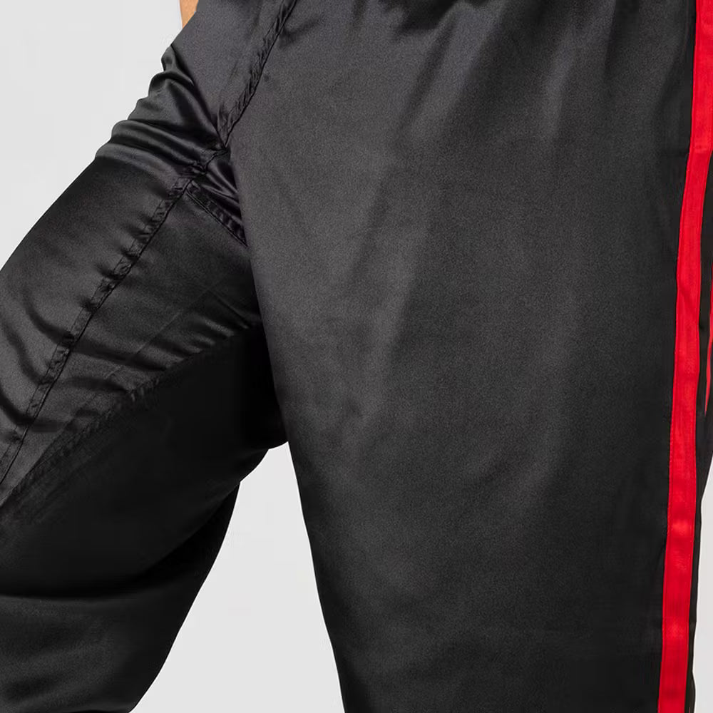 Black and red Blitz adult satin contact trousers for martial arts, showing the lightweight, smooth fabric and fitted design.