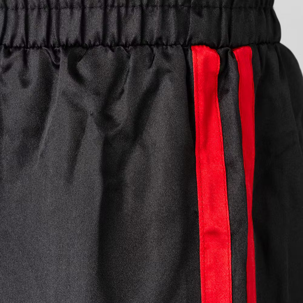 Black and red Blitz adult classic satin contact trousers for martial arts, featuring a smooth, shiny fabric and comfortable fit.