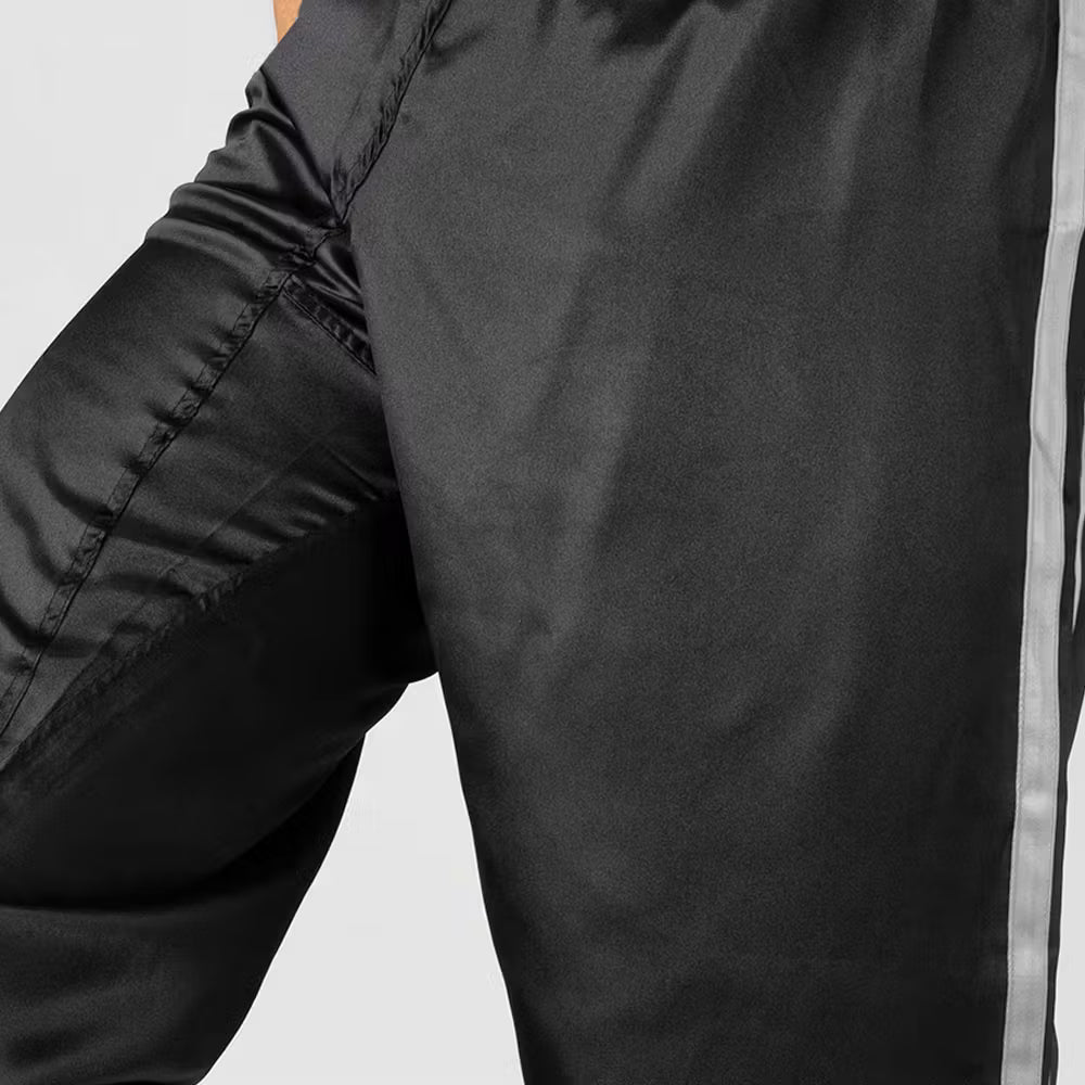 Black and white Blitz adult satin contact trousers for martial arts, featuring a classic design and comfortable fit.