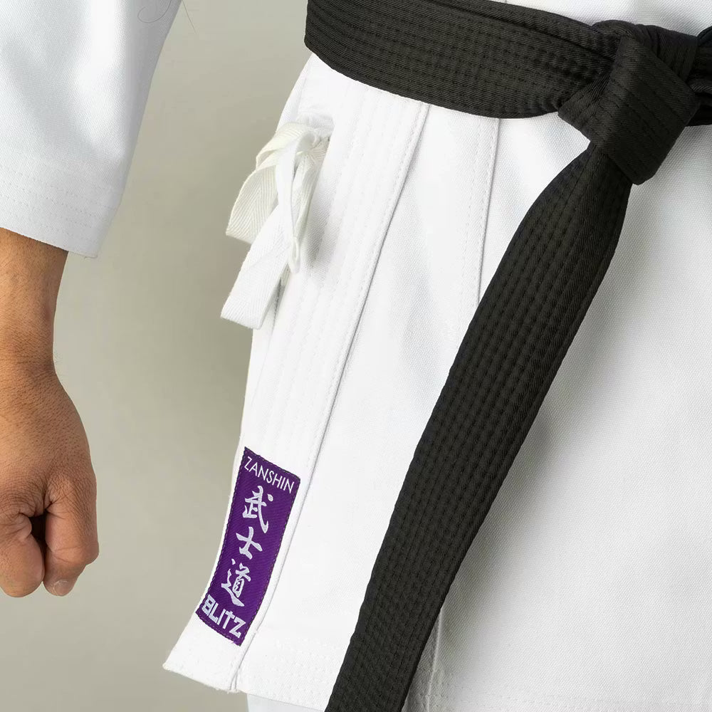 White Blitz adult Zanshin Karate Gi made of 12oz woven cotton, designed for training and martial arts practice.
