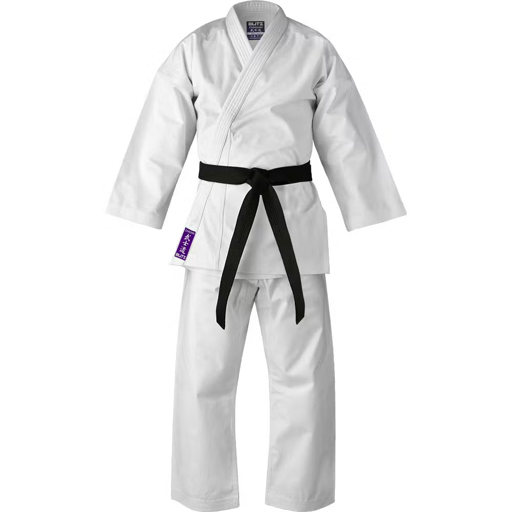 White adult Blitz Zanshin Karate Gi made of 12oz woven cotton, shown laid flat with a traditional karate uniform appearance.