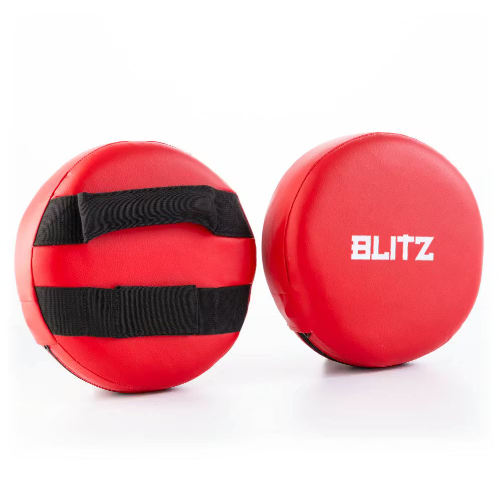 Red Blitz Circular Focus Pads, round Thai training mitts for boxing and martial arts training, with padded surface for impact absorption.