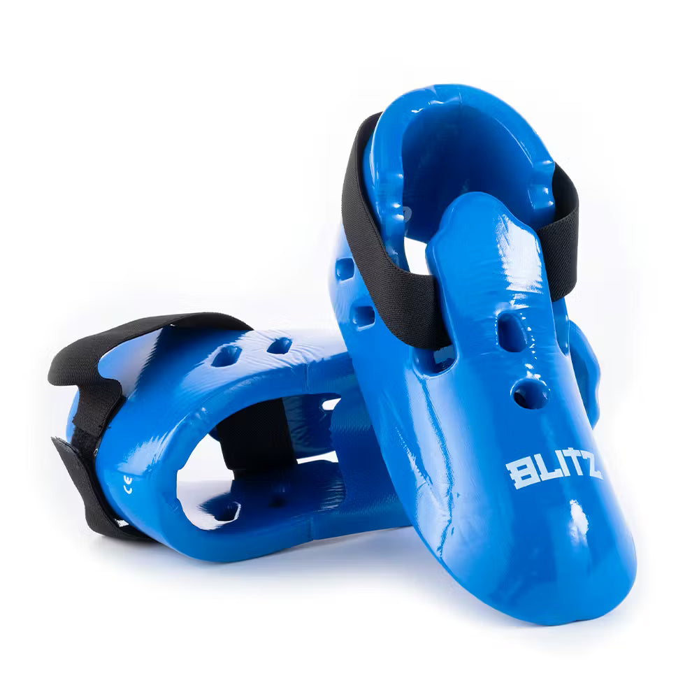 Blue Blitz dipped foam foot guards providing lightweight protection, designed for comfort and safety during activities.