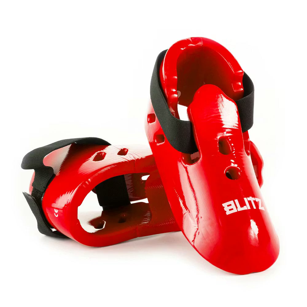 Red Blitz dipped foam foot guards for lightweight protection, featuring padded dipped foam design and secure fit.