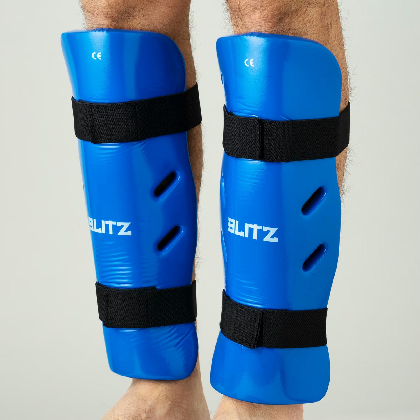 Blue Blitz Dipped Foam Shin Guards offering lightweight shin protection with padded dipped foam design for sports safety.