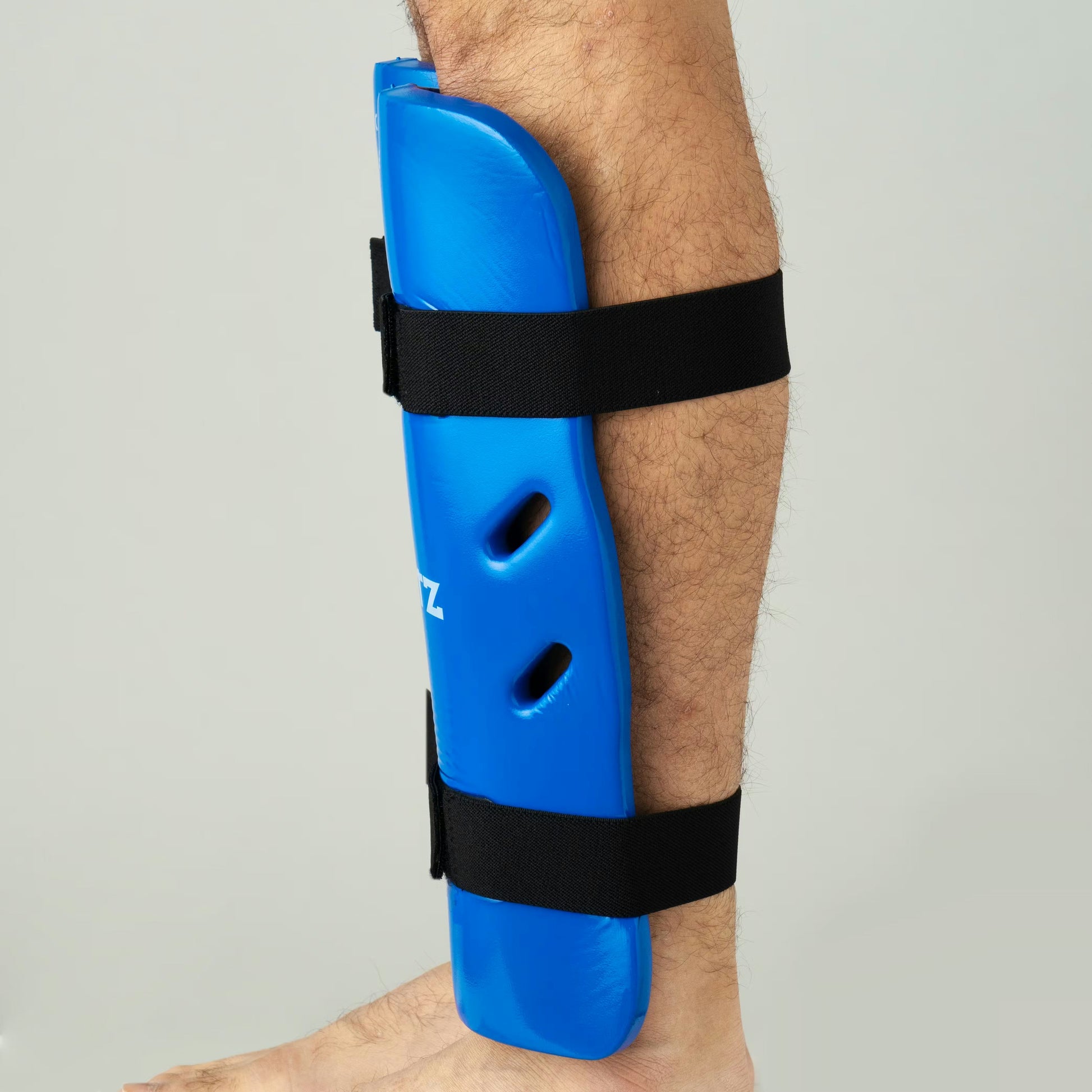 Blitz Dipped Foam Shin Guards showing lightweight, padded protection for the shins with black dipped foam exterior.