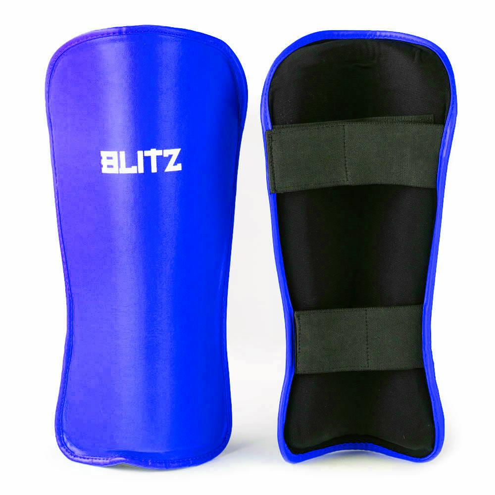 Blue Blitz Fusion Shin Guards with high-density foam padding for secure lower leg protection during sports.