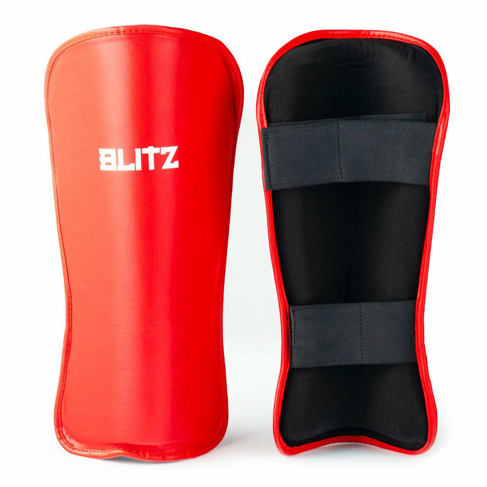 Red Blitz Fusion Shin Guards with high-density foam padding for protective soccer or football shin guard coverage.