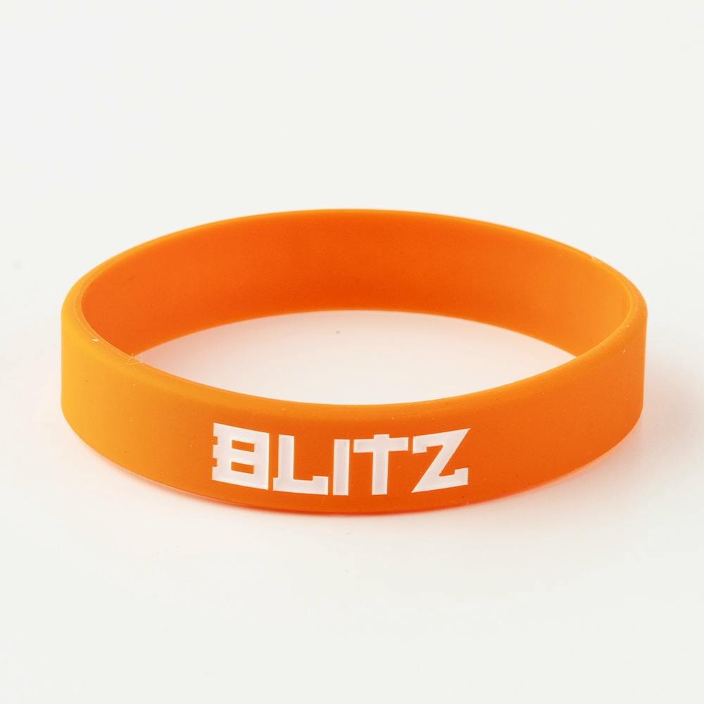 Orange Blitz Grading Wrist Band for belt grade display, worn on the wrist as a visual grading accessory.