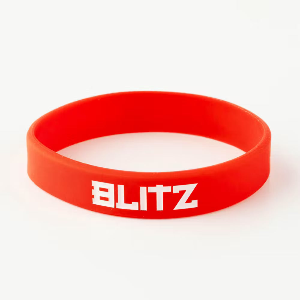 Red Blitz Grading Wrist Band displaying belt grade, made of durable material, worn on the wrist for grading visibility.
