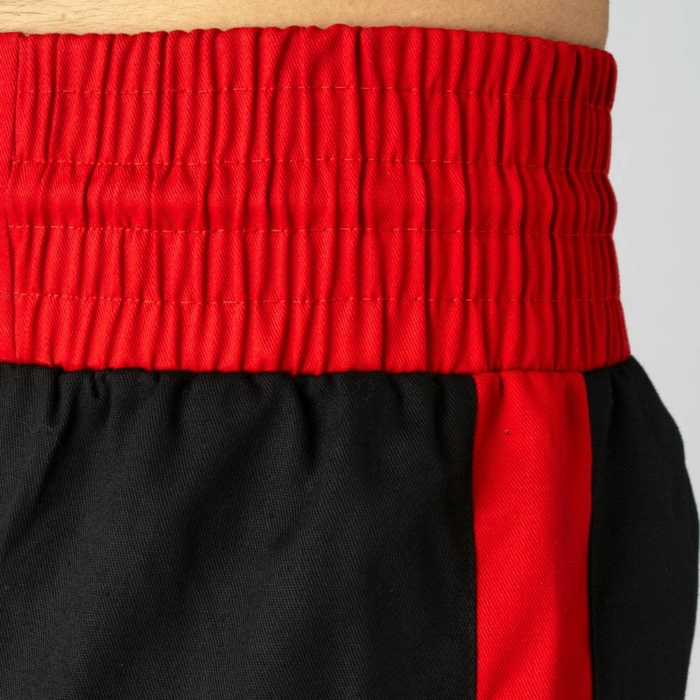 Black and red Blitz Kids Defiant Kickboxing Trousers for youth training, made from durable polycotton fabric, featuring a comfortable fit.