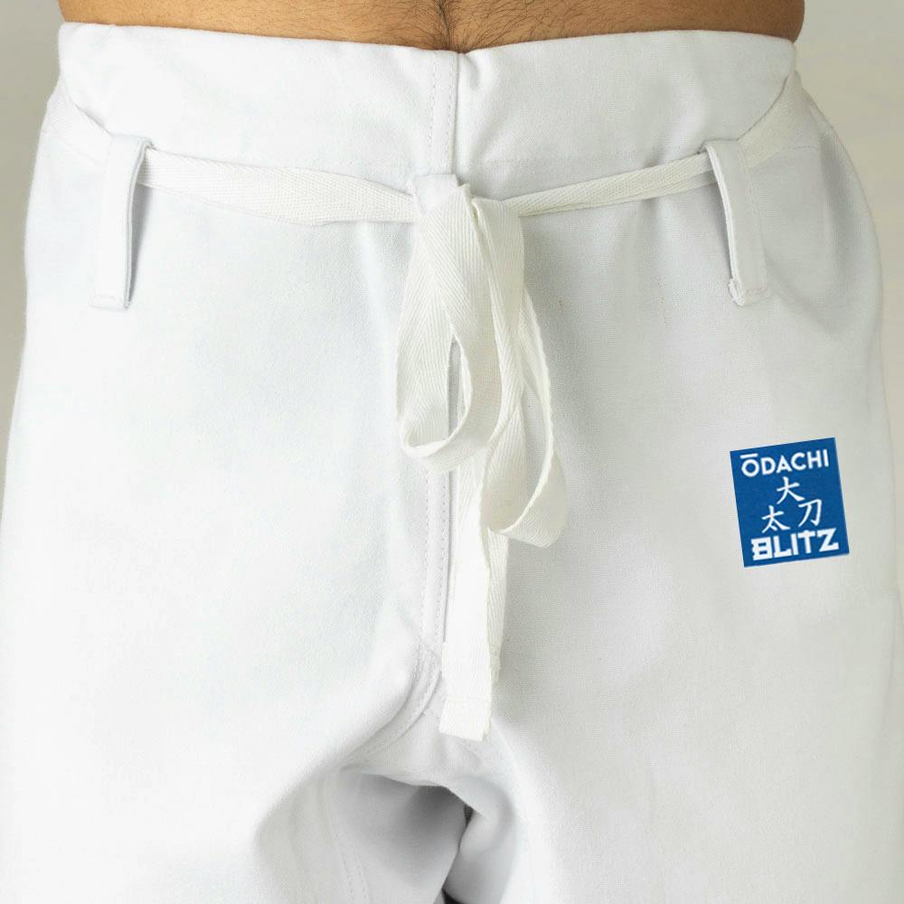 Blitz Kids Odachi Kata Karate Gi 14oz, white martial arts uniform with reinforced stitching and traditional design for children.