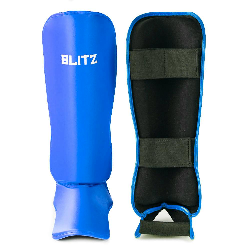 Blue Blitz Nitro Shin Guards designed for protection, with padded coverage and adjustable straps for a secure fit.