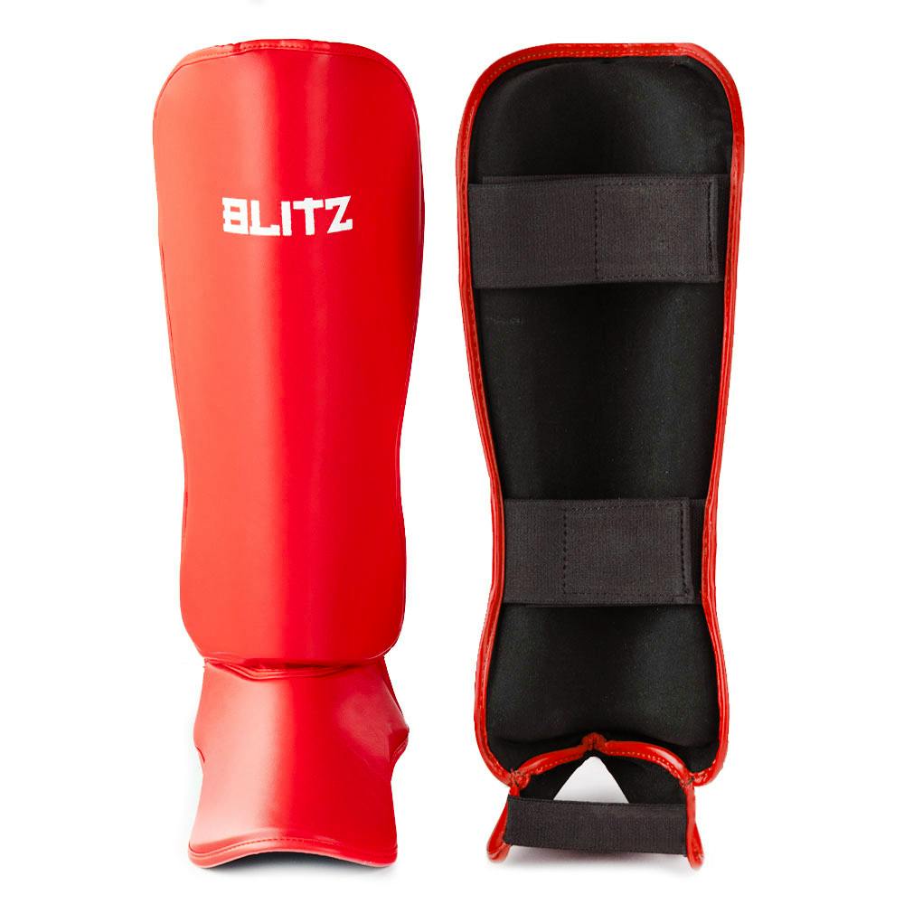 Red Blitz Nitro Shin Guards for soccer, providing durable protection and secure fit for athletes.