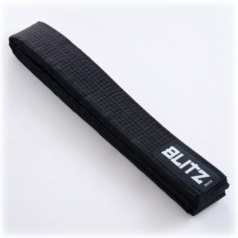 Black Blitz martial arts grading belt made of plain colored fabric, designed for training and competitions.