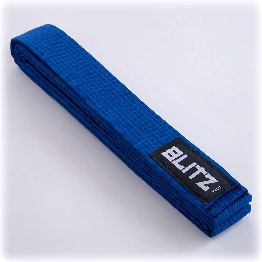 Blue Blitz plain martial arts belt lying flat, showing smooth fabric and clean stitching, suitable for training or competition.