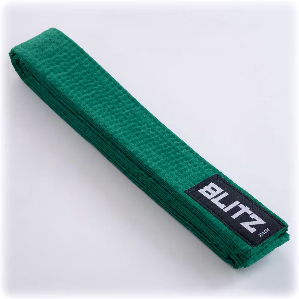 Green Blitz plain martial arts belt made of durable fabric, suitable for training and competitions.