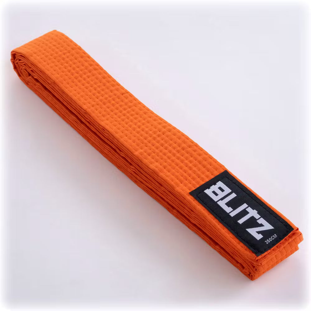 Orange Blitz plain martial arts belt made of durable fabric, suitable for training and competitions.