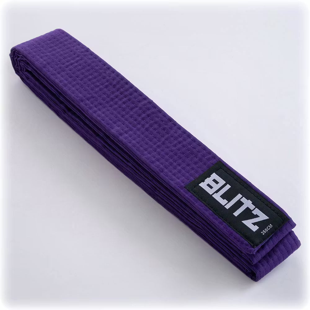 Purple Blitz martial arts grading belt made of plain fabric, with reinforced stitching and a smooth, clean finish.
