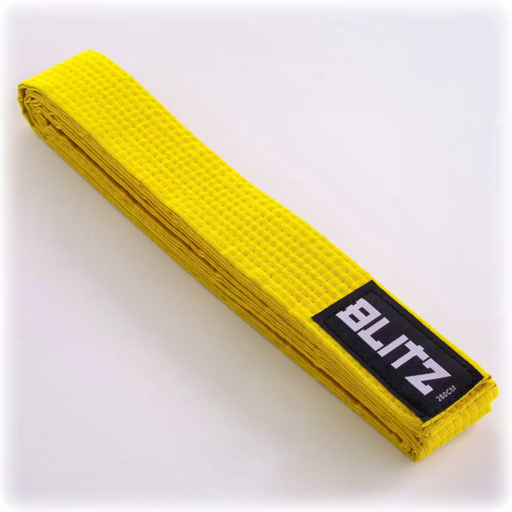 Yellow Blitz plain martial arts grading belt made of durable fabric, suitable for training and competition.