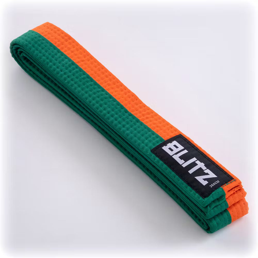 Green and orange Blitz split-length martial arts belt, 4.5cm wide, with woven fabric and reinforced edges, suitable for martial arts training.