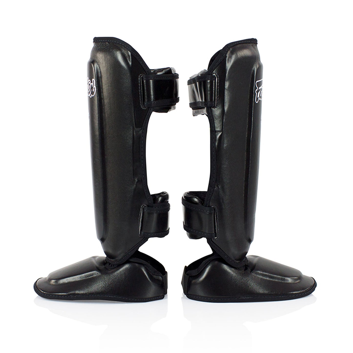 Black Fairtex SPK9 Kids Shin Pads for martial arts, showing padded shin protection designed for young athletes in sporting goods.