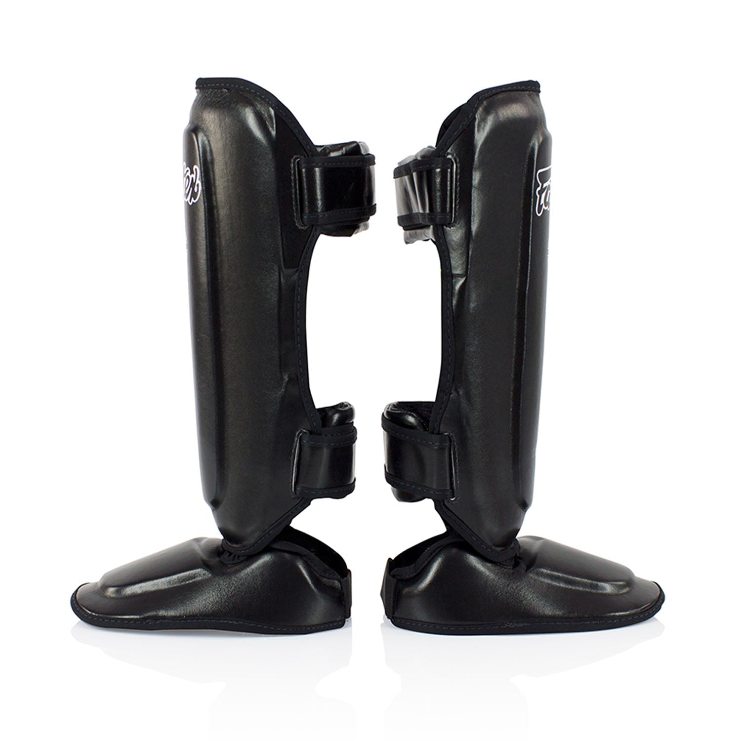 Black Fairtex SPK9 Kids Shin Pads for martial arts, showing padded shin protection designed for young athletes in sporting goods.