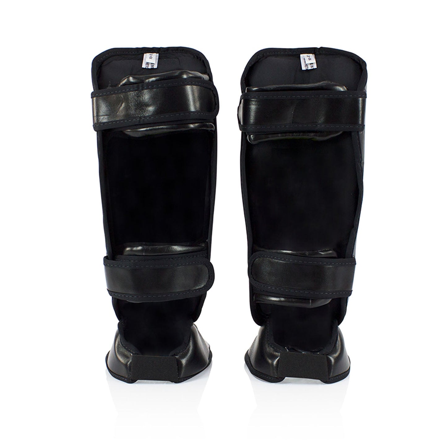 Fairtex SPK9 kids shin pads in black, padded protective sporting gear for youth martial arts or boxing training.