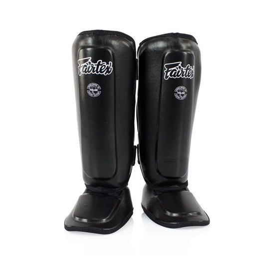 Black Fairtex SPK9 Kids Shin Pads designed for martial arts or sports training, showing padded shin protection for children.