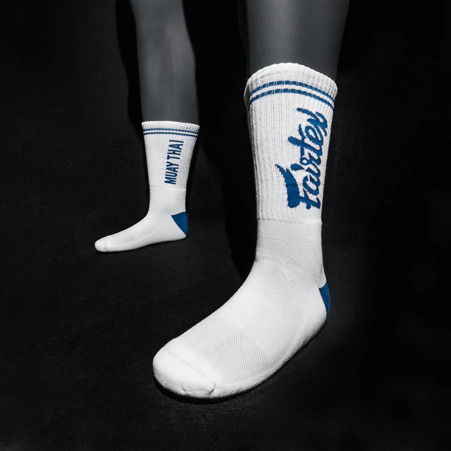 Fairtex white and blue sports socks with reinforced heel and toe, designed for athletic comfort and performance.