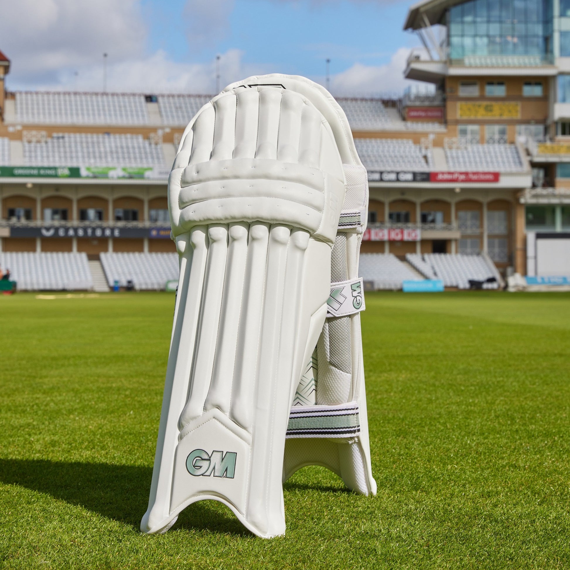 Gunn & Moore GM Cricket 808 batting pads, padded leg guards with adjustable straps, designed for cricket players.