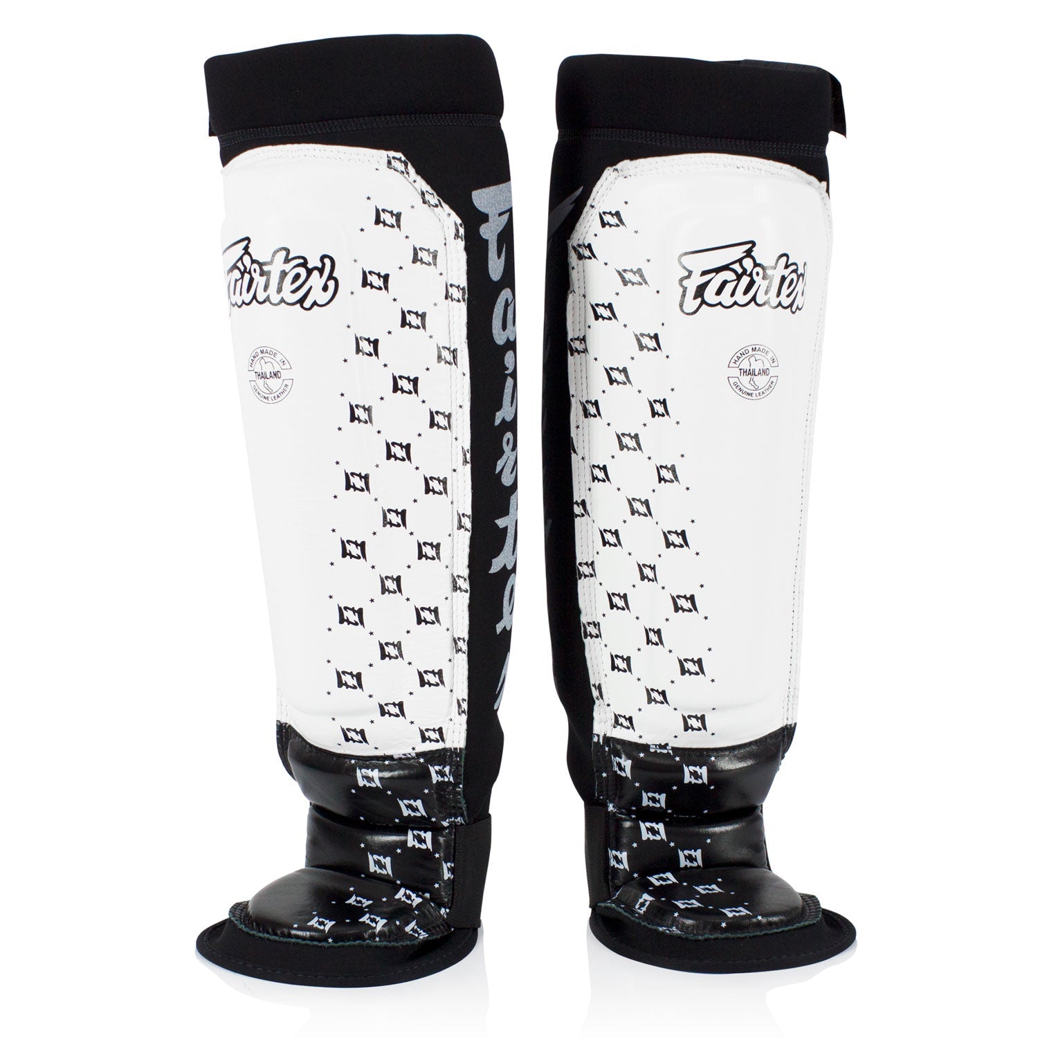 Fairtex neoprene MMA shin pads in white and black with padded protection for martial arts training.